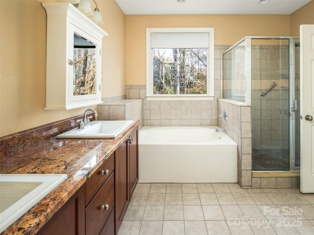 bathroom with vanity, tile patterned flooring, and independent shower and bath