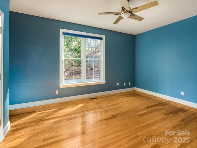 unfurnished room with light hardwood / wood-style flooring and ceiling fan