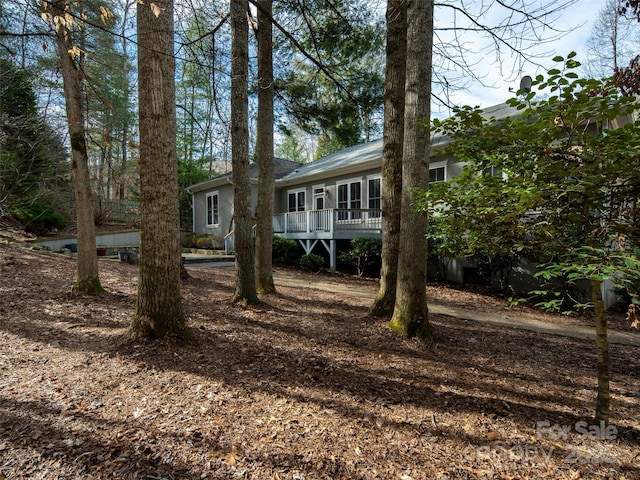 exterior space featuring a wooden deck