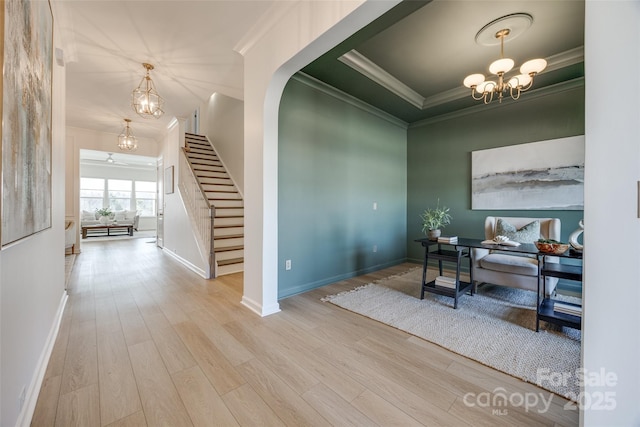 office with baseboards, crown molding, a chandelier, and wood finished floors