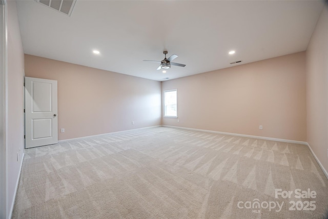 unfurnished room with light carpet, baseboards, and visible vents