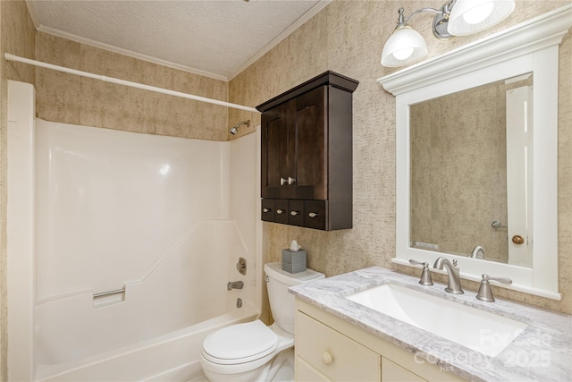 full bathroom featuring bathing tub / shower combination, toilet, vanity, a textured ceiling, and wallpapered walls