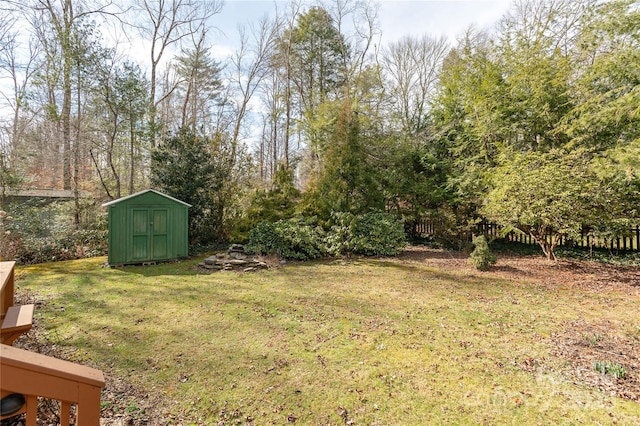 view of yard featuring an outbuilding and a storage unit