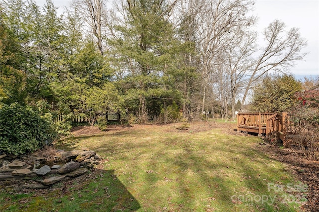 view of yard featuring a wooden deck