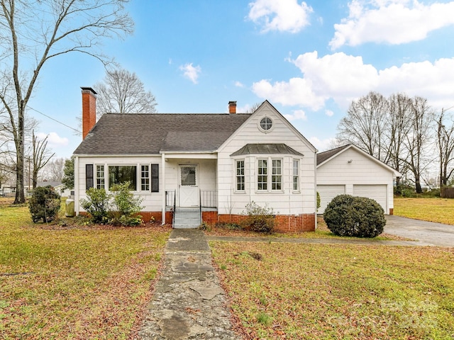 ranch-style house featuring a front lawn and a garage