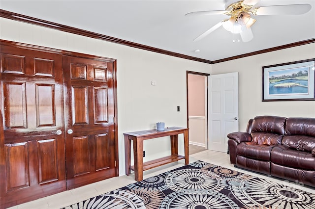 living room with ornamental molding and ceiling fan