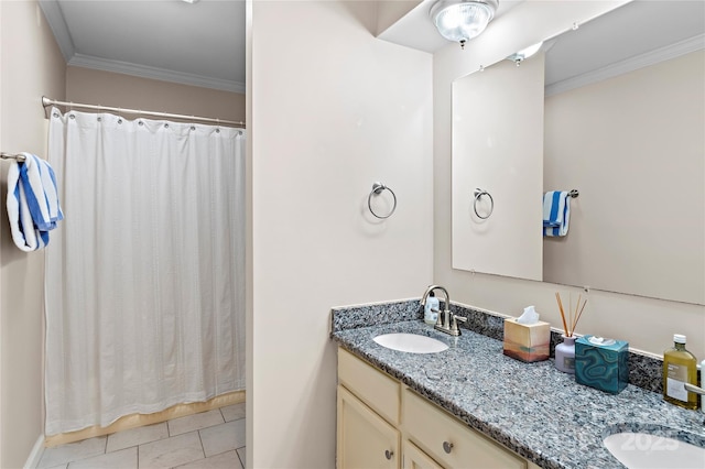 bathroom featuring vanity, ornamental molding, and tile patterned flooring