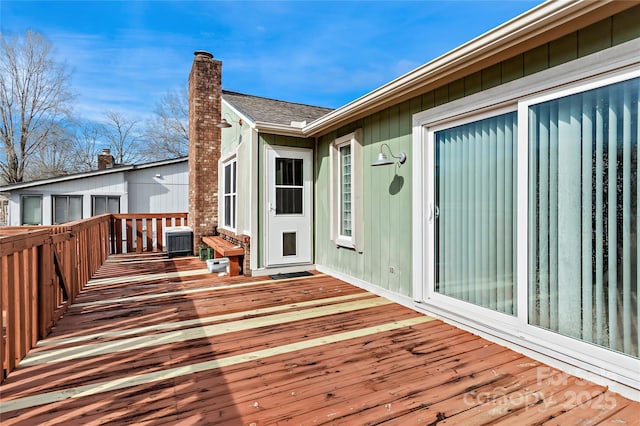 wooden deck with central AC unit