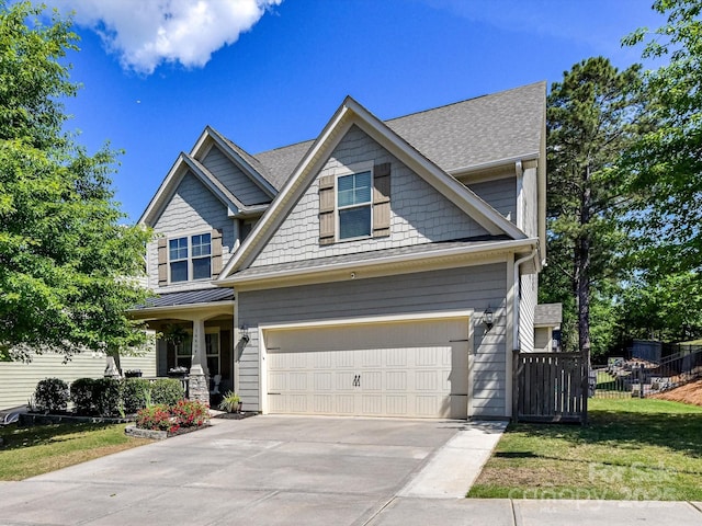 16404 Mckee Ridge Dr, Charlotte, NC 28278 - craftsman-style home with driveway, fence, covered porch, an attached garage, and a front yard