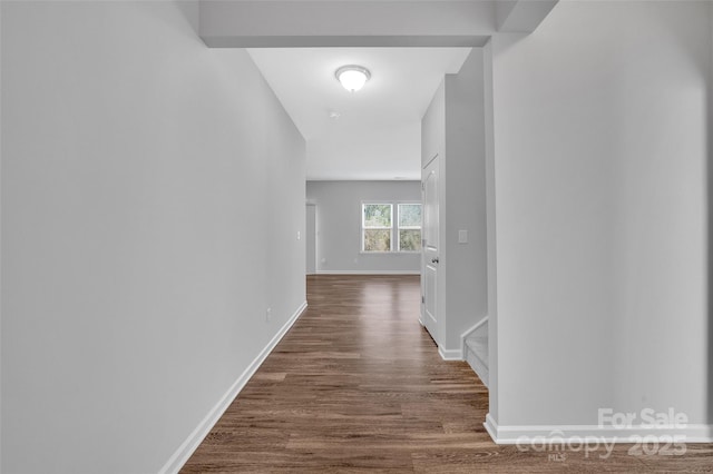 hall with dark hardwood / wood-style floors