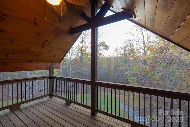 wooden deck featuring ceiling fan