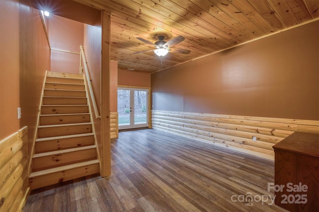 stairway with hardwood / wood-style flooring, ceiling fan, wood ceiling, and french doors