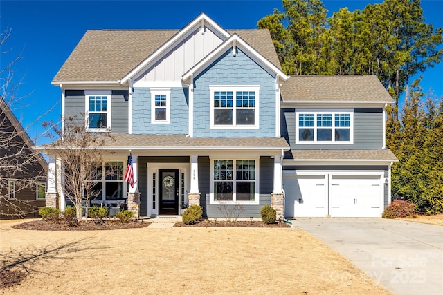 craftsman inspired home featuring roof with shingles, concrete driveway, covered porch, an attached garage, and board and batten siding