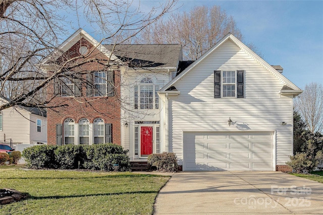 front of property with a front yard and a garage