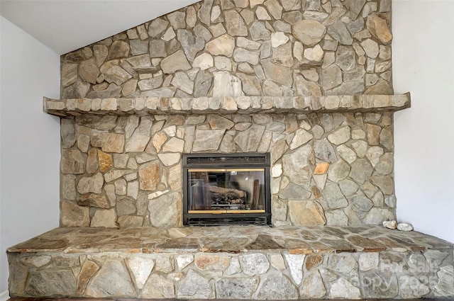 room details featuring a stone fireplace