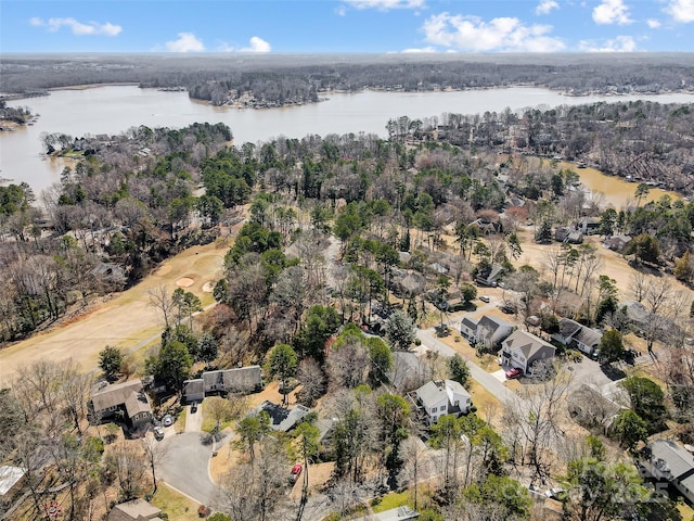 bird's eye view with a water view and a view of trees