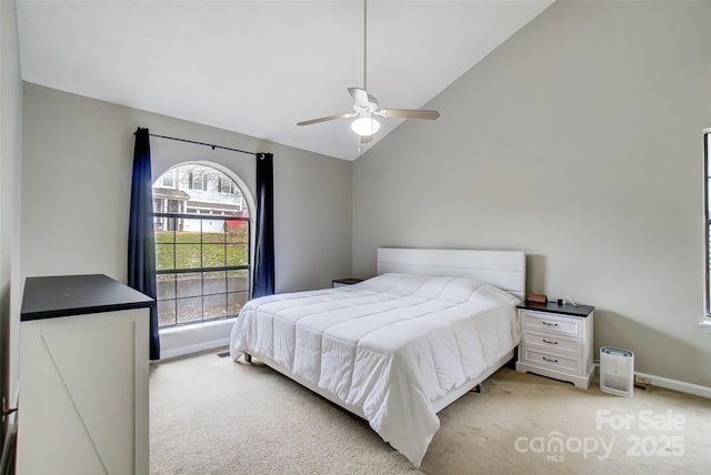 bedroom featuring high vaulted ceiling, light colored carpet, ceiling fan, and baseboards