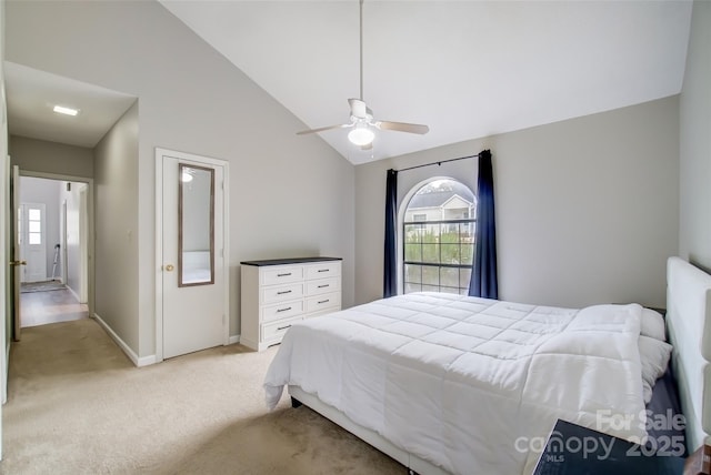 bedroom with a ceiling fan, light carpet, high vaulted ceiling, and baseboards