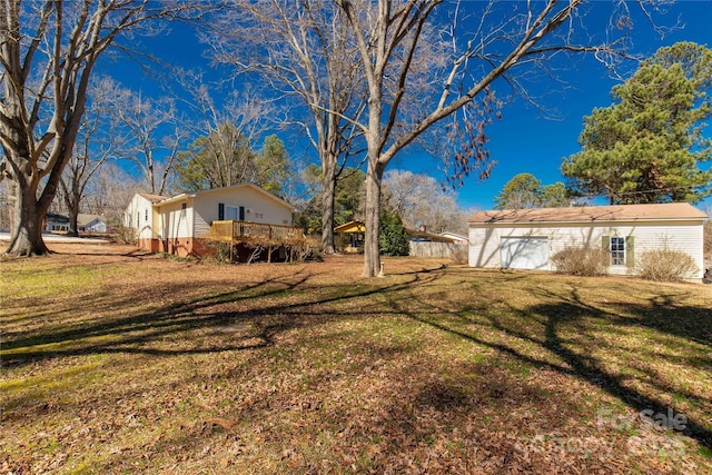 view of yard featuring a wooden deck