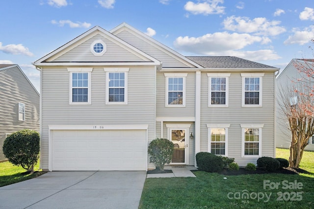 view of front facade featuring a front lawn, an attached garage, and driveway