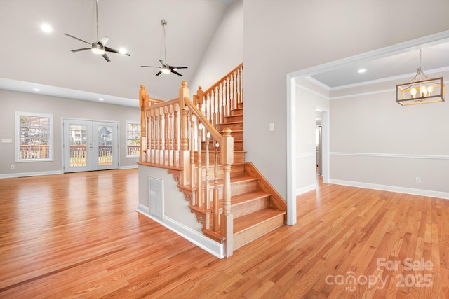 126 Emerald Dr, Mooresville, NC 28117 - staircase with wood finished floors, ceiling fan with notable chandelier, baseboards, and recessed lighting