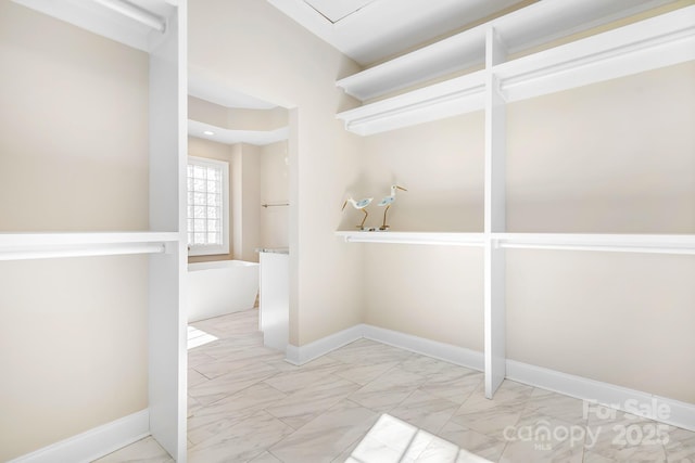 126 Emerald Dr, Mooresville, NC 28117 - walk in closet featuring marble finish floor