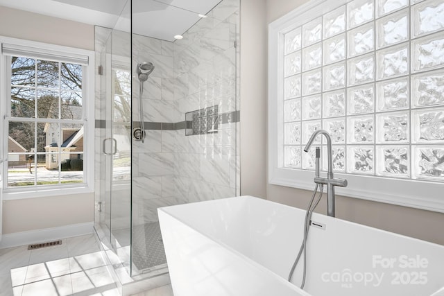 126 Emerald Dr, Mooresville, NC 28117 - bathroom featuring a shower stall, marble finish floor, visible vents, baseboards, and a freestanding tub