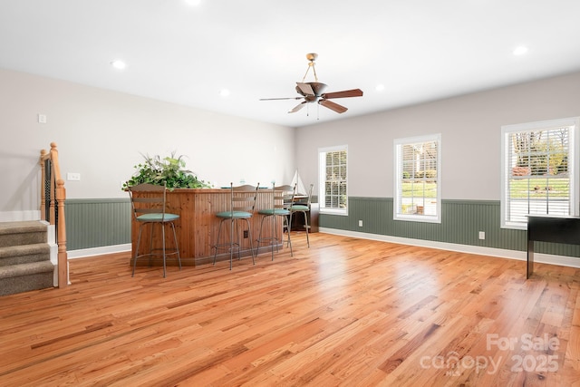 126 Emerald Dr, Mooresville, NC 28117 - office space with a bar, wainscoting, and light wood-type flooring