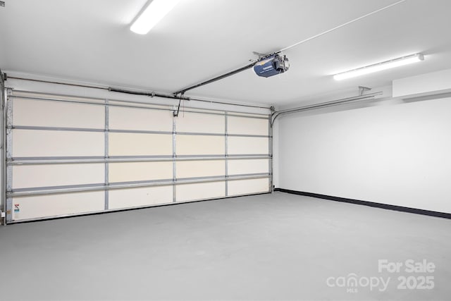 126 Emerald Dr, Mooresville, NC 28117 - garage featuring baseboards and a garage door opener