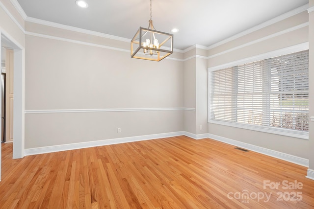 126 Emerald Dr, Mooresville, NC 28117 - spare room featuring baseboards, a chandelier, light wood-style flooring, crown molding, and visible vents