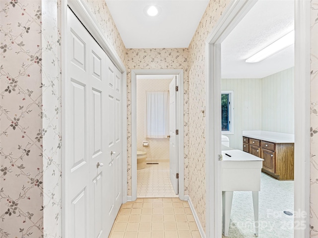 hallway featuring light tile patterned flooring