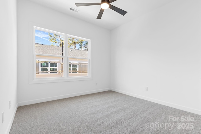 unfurnished room with ceiling fan and carpet floors