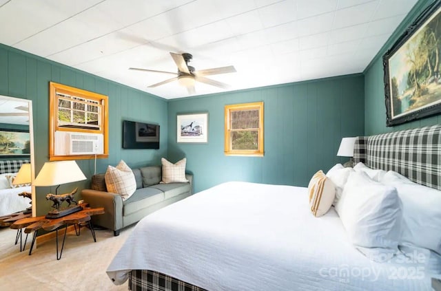 carpeted bedroom with ceiling fan and cooling unit