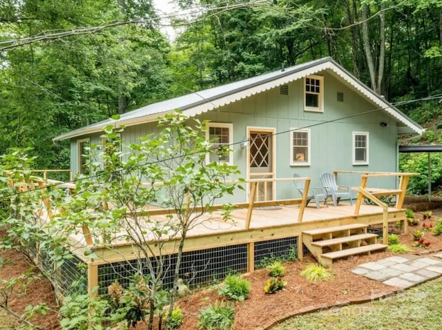 rear view of property with a deck