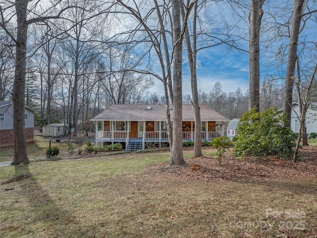 view of front facade with a porch and a front yard