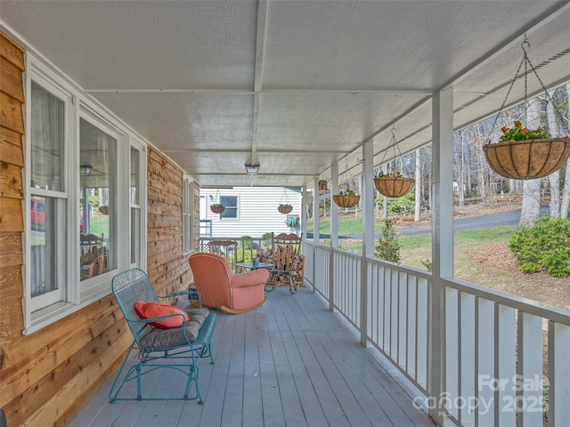 wooden deck featuring covered porch