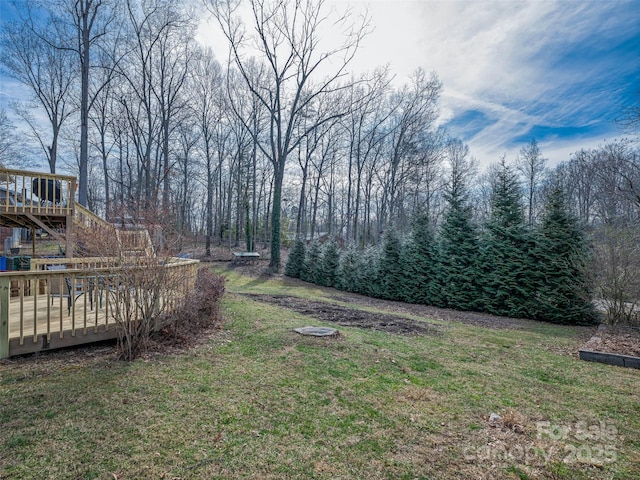 view of yard with a wooden deck