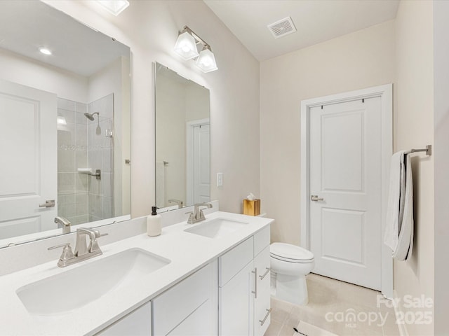 4010 Citra Ln, Charlotte, NC 28217 - full bathroom with tile patterned flooring, toilet, tiled shower, and double vanity