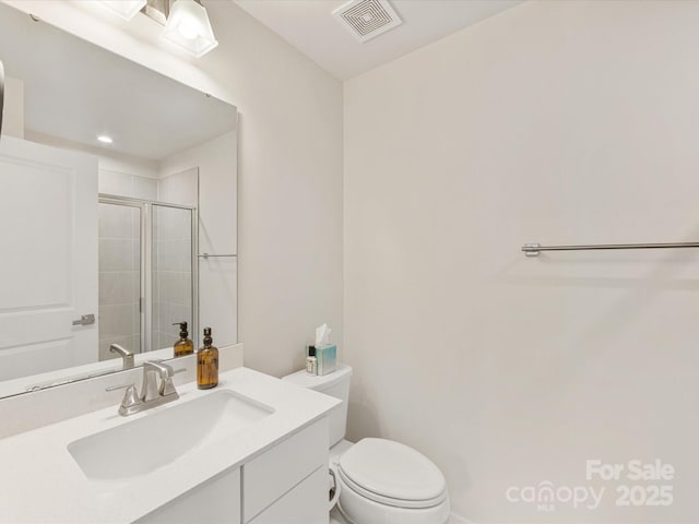 4010 Citra Ln, Charlotte, NC 28217 - bathroom featuring a stall shower, toilet, and vanity