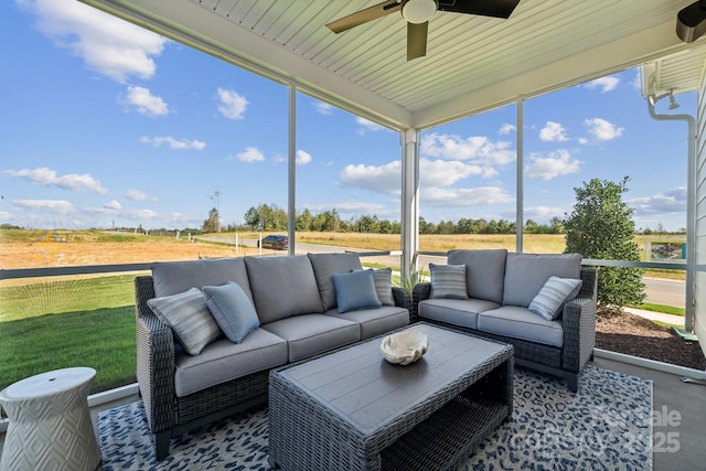 sunroom with ceiling fan and plenty of natural light