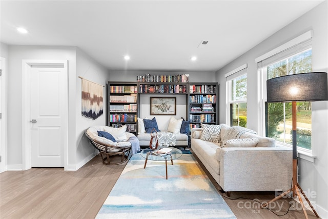 living area with light hardwood / wood-style flooring