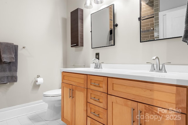 bathroom with toilet and vanity