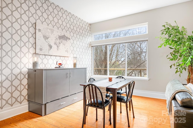 dining area featuring a wealth of natural light and light hardwood / wood-style floors