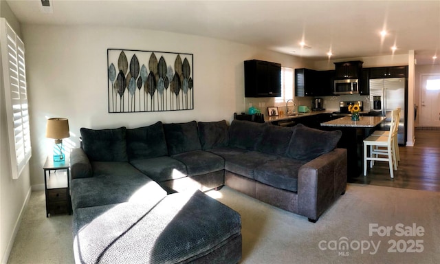 living room featuring light wood-style flooring and baseboards