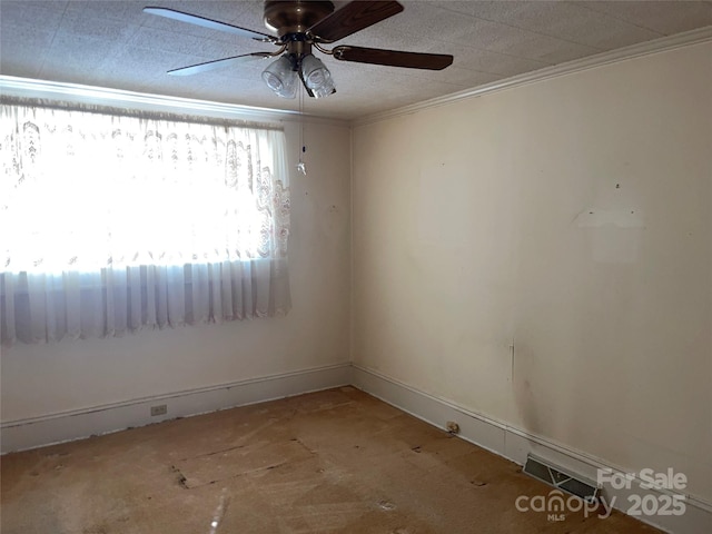 spare room with visible vents, baseboards, ceiling fan, ornamental molding, and a textured ceiling