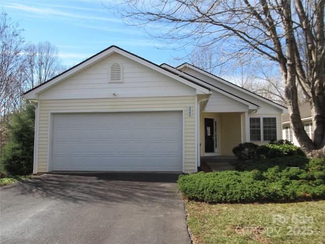 single story home with a garage