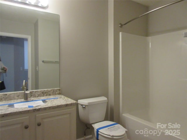 bathroom with toilet and vanity