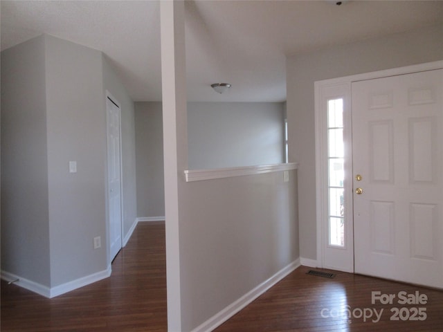 foyer entrance with dark hardwood / wood-style flooring