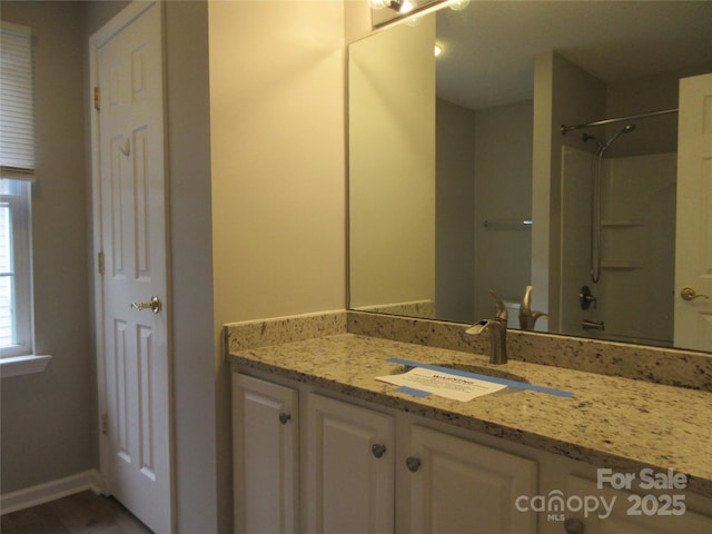 bathroom featuring vanity and walk in shower