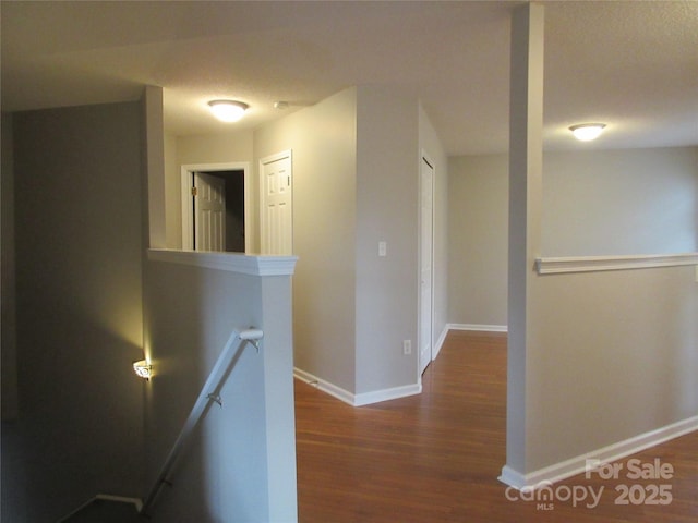 hallway featuring dark hardwood / wood-style floors